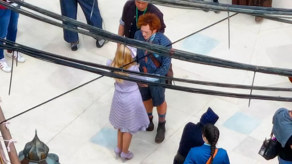 Ariana Grande and Ethan Slater on the Wicked movie set